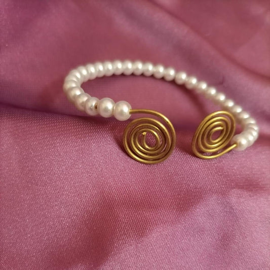 Pearl and gold swirl bracelet